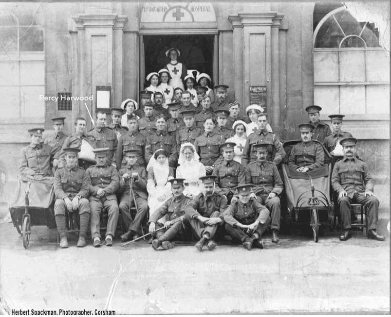 Percy Francis Harwood at Corsham Town Hospital. Note the different styles of the two Bath chairs. The Daily Needs board to the right of the door is difficult to read, but ap- pears to state “broom head, flowers, matches, outdoor games”