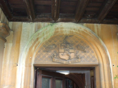 Neale arms and dates above the rear en- trance to the Mansion House. Dates of 1721 and 1897 either side of the coat of arms signify the dates.