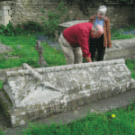 Mr, Garrett, a descendant of Mary, wife of Charles Mayo, visits the grave while on a family research trip from Australia, c.2008.