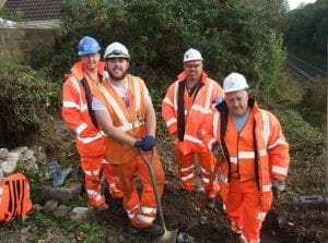 Workers preparing the site before removing the old footbridge