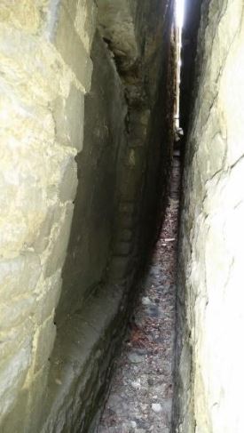 The blocked up window in the west wall of the former malthouse