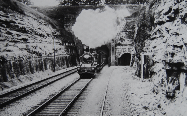 One of William Dean’s famous 4-2-2 singles of the mid 1890’s emerging from the Corsham end of the tunnel.  The tunnel to the right gave access to the stone quarries of the Hartham & Yockney Stone Quarrying Company.