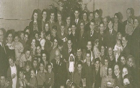 Rising Sun Christmas Party 1946 – the current chairman is in his mother’s arms, 2nd person standing on the left